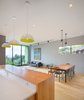 Modern home with Dining Room, Bench, Chair, Medium Hardwood Floor, Table, and Pendant Lighting. Living space out to the view Photo 8 of Panavista Hill House