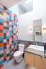 Modern home with Bath Room, Quartzite Counter, Porcelain Tile Floor, Vessel Sink, Ceramic Tile Wall, One Piece Toilet, and Wall Lighting. Powder Photo 10 of Panavista Hill House