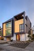 Modern home with Exterior, Metal Roof Material, House Building Type, Flat RoofLine, Metal Siding Material, and Shed RoofLine. Exterior front corner with stepping tubes Photo of Lightbox 23