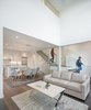Modern home with Living Room, Medium Hardwood Floor, Coffee Tables, Sofa, and Recessed Lighting. Open living space with 2-story volume Photo 4 of Lightbox 23