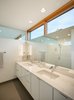 Modern home with Bath Room, Porcelain Tile Floor, Porcelain Tile Wall, Wall Lighting, Undermount Sink, Recessed Lighting, Engineered Quartz Counter, and Open Shower. Master bath with ribbon of windows and clerestory glass Photo 7 of Lightbox 23