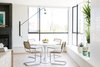 Dining room featuring Saarinen table and RH chairs. Photo 3 of Laurel Heights Residence modern home