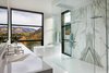 Modern home with Bath Room, Wall Mount Sink, Porcelain Tile Floor, Marble Counter, Enclosed Shower, Recessed Lighting, and Freestanding Tub. Maroon Creek Overlook Master Bathroom. © Copyright CCY Architects. Photo 6 of Maroon Creek Overlook