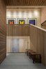 Modern home with Hallway and Light Hardwood Floor. CCY Architects | Red Butte Entrance - • The desire for privacy generated the wood screens. The interior screens pull together compositionally and allow light to filter down to lower levels. Photo 3 of Red Butte