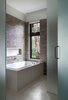 Modern home with Bath Room, Recessed Lighting, Enclosed Shower, Mosaic Tile Wall, and Limestone Floor. The bathroom was designed with a Limestone floor, Mosaic tile walls with integral niche, and slab tub surround. Photo 8 of Woody Creek Residence