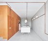 Modern home with Kitchen, Concrete Floor, Ceiling Lighting, Wall Lighting, Drop In Sink, and Engineered Quartz Counter. Kitchen island Photo of The Marina Apartment