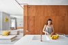 Modern home with Kitchen, Wall Lighting, White Cabinet, Refrigerator, Wine Cooler, Microwave, Concrete Floor, and Drop In Sink. View from the kitchen towards living and sleeping zone. Photo 3 of The Marina Apartment