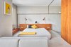 Modern home with Concrete Floor and Wall Lighting. Bedroom Photo 14 of The Marina Apartment