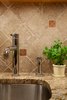 Backsplash and countertop detail image. Granite counters, chrome fixtures and stainless steel appliances and sink. Photo 3 of Dog Lover's Apartment modern home