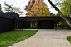 Modern home with Exterior, Wood Siding Material, Flat RoofLine, House Building Type, Concrete Siding Material, and Glass Siding Material. Main entrance Photo 2 of Prévert