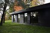 Modern home with Exterior, Glass Siding Material, House Building Type, Wood Siding Material, and Concrete Siding Material. Bedroom aisle Photo 5 of Prévert