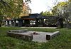 Modern home with Outdoor, Stone Patio, Porch, Deck, Large Patio, Porch, Deck, Grass, Back Yard, Hanging Lighting, and Trees. Back view Photo 7 of Prévert