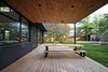 Modern home with Outdoor, Vertical Fences, Wall, Large Pools, Tubs, Shower, Trees, Wood Patio, Porch, Deck, Swimming Pools, Tubs, Shower, Large Patio, Porch, Deck, Wood Fences, Wall, and Back Yard. Outdoor lunch area Photo 8 of Prévert