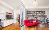 The entertainment space adds a pop of color with the Roche Bobois sofa Photo 4 of Atwater modern home