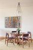 Modern home with Dining Room. The furniture and artwork nod at the Midcentury modern design elements that also seamlessly integrate throughout the condo. Photo 3 of Tanner Place