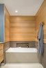 Modern home with Chair, Table, Study Room Type, Library Room Type, Storage, Shelves, Desk, Alcove Tub, and Bath Room. Mixed materials are presented in the tub alcove Photo 6 of Tanner Place