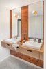 Modern home with Light Hardwood Floor and Bath Room. Mixed materials create a sleek, earthen inspired vanity Photo 2 of Hurst Avenue