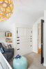 Modern home with Wood Counter, Ceramic Tile Floor, Drop In Sink, Wall Lighting, and Kids Room. Fun shapes make for the perfect Scandinavian modern nursery Photo 3 of Hurst Avenue