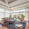 Modern home with Living Room. Spacious ceiling heights with specific furniture elude to restful luxury Photo of Block 90 Penthouse