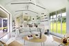 Modern home with Living Room, Sofa, Concrete Floor, and Pendant Lighting. Upcountry Maui Cottage and Barn: Kitchen and Living Room Photo 3 of Haiku Maui