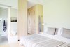 Modern home with Bedroom, Light Hardwood Floor, and Bed. Upcountry Maui Cottage and Barn: master bedroom Photo 9 of Haiku Maui