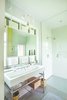 Modern home with Bath Room, Pedestal Sink, Porcelain Tile Floor, Ceramic Tile Wall, and Open Shower. Upcountry Maui Cottage and Barn: master bathroom Photo 7 of Haiku Maui