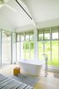 Modern home with Bedroom and Light Hardwood Floor. Upcountry Maui Cottage and Barn: soaking tub in master bedroom Photo 8 of Haiku Maui