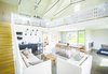 Modern home with Living Room, Sofa, and Chair. Upcountry Maui Cottage and Barn: Barn living space Photo 15 of Haiku Maui