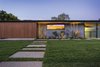 Front Walkway - A Hidden Service Entrance Door in the Cedar Siding uses a keyfob to electronically open the door. Photo 9 of The Pinstripe House - Mid-Century Modern Minimalism. Available for $7,750,000 modern home