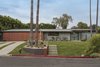 Street View showing the matching Cedar Siding Mailbox and flush to face garage door. Photo 10 of The Pinstripe House - Mid-Century Modern Minimalism. Available for $7,750,000 modern home