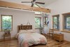 Modern home with Bedroom, Medium Hardwood Floor, Bed, Bookcase, Storage, and Pendant Lighting. Master Bedroom Photo 8 of Sliwinski Residence