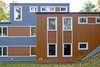 Modern home with Exterior, House Building Type, Metal Roof Material, and Wood Siding Material. Back Elevation Photo 11 of Sliwinski Residence
