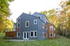 Modern home with Exterior, House Building Type, Metal Roof Material, and Wood Siding Material. Sloping Site with Daylight Basement Photo 10 of Sliwinski Residence