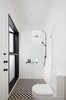 The ensuite bathroom and shower zone connects to a verdant private courtyard. Photo 10 of Enmore House modern home