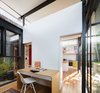 Solid sliding panels allow the home office and study to be entirely private or open up and connect to the living spaces of the home. The space doubles as a private guest room when required. Photo 12 of Enmore House modern home