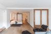 Frans and Dalal worked with the GC to create two customized and flexible sleeping spaces. He built sliding accordion doors out of walnut wood and opaque resin that stack together out of the way when opened, or become solid partition walls when extended and closed off. Photo 5 of Gramercy Studio Renovation modern home