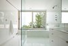 Modern home with Bath Room, Ceramic Tile Wall, Engineered Quartz Counter, Ceramic Tile Floor, Freestanding Tub, and Open Shower. Master Bath Photo 6 of Orient House IV
