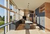 Modern home with Kitchen, Light Hardwood Floor, Granite Counter, Undermount Sink, and Pendant Lighting. Gray cabinets are paired with granite countertops and a white marble island from Vermont. Photo 3 of Orient House V