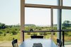 Modern home with Dining Room, Table, and Chair. The home features expansive wetland views. Photo 7 of Orient House V