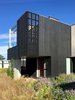 Modern home with Exterior, Wood Siding Material, Flat RoofLine, and House Building Type. To bring the property back to its natural glory, landscape architect Lillian Ball removed invasive plantings and replaced them with indigenous landscaping. Photo 14 of Orient House V