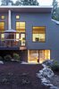 Modern home with Outdoor, Back Yard, Woodland, Slope, Shrubs, Trees, Boulders, Metal Patio, Porch, Deck, Hardscapes, Large Patio, Porch, Deck, Pavers Patio, Porch, Deck, and Decking Patio, Porch, Deck. View at rear Photo 4 of The Frederick McKeehan Residence