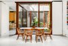 Modern home with Dining Room, Concrete Floor, Chair, and Table. Dining room into Atrium Photo of Brooklyn Carriage House