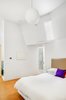Modern home with Bedroom, Night Stands, Pendant Lighting, and Bed. Master Bedroom Photo 6 of Brooklyn Carriage House