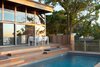 Sunset Pool View Photo of Bay Walk Residence modern home