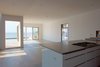 Modern home with Living Room, Light Hardwood Floor, Hanging Fireplace, Recessed Lighting, and Ceiling Lighting. Living - dining room with bay view Photo 7 of Bay View House