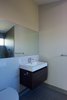 Modern home with Bath Room, Porcelain Tile Wall, Enclosed Shower, Ceiling Lighting, One Piece Toilet, Wall Mount Sink, and Porcelain Tile Floor. Guest bathroom Photo 13 of Bay View House