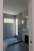 Modern home with Bath Room, Porcelain Tile Wall, Enclosed Shower, Ceiling Lighting, One Piece Toilet, Porcelain Tile Floor, Full Shower, Recessed Lighting, and Vessel Sink. Guest bathroom Photo 11 of Bay View House