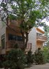 Modern home with Exterior, Beach House Building Type, Tile Roof Material, Wood Siding Material, House Building Type, and Shed RoofLine. Front Yard Photo 4 of Bay View House