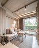 Modern home with Living Room, Sofa, Chair, and Ceramic Tile Floor. Main living area with bespoke furniture set Photo 2 of T House