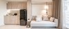 Modern home with Living Room, Chair, Sofa, Wall Lighting, Ceiling Lighting, and Ceramic Tile Floor. Existing pantry re-finish with wood texture plastic laminated Photo 13 of T House